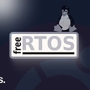 Logo FreeRTOS con TUX de fondo